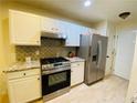 Well-appointed kitchen featuring stainless steel appliances and granite countertops at 3466 Carriage Chase Rd, Atlanta, GA 30349