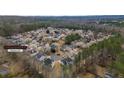 Aerial view of a residential neighborhood with well-maintained homes and mature trees, offering a serene living environment at 5706 Spring Mill Cir, Lithonia, GA 30038