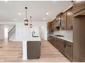 Open kitchen design with large central island, stainless steel appliances, and plenty of cabinet space at 1465 Auburn Glen Rd, Dacula, GA 30019