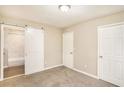 Spacious bedroom featuring a modern sliding door leading to an attached bathroom at 1643 Pine Glen Cir, Decatur, GA 30035