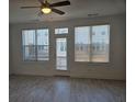Bright living room featuring lots of natural light with stylish light fixtures and contemporary flooring at 1309 Bennett Creek Ovlk, Suwanee, GA 30024