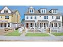 New townhome showcasing brick accents, white siding and picket fence at 208 Village Overlook # J3, Canton, GA 30114