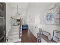 Grand foyer with hardwood floors, high ceilings, staircase, and wainscoting, creating an elegant entrance at 2995 Barimore, Dacula, GA 30019