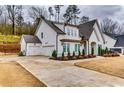 Charming home featuring a three-car garage and well-maintained lawn at 4750 Fields Bridge Rd, Cumming, GA 30028