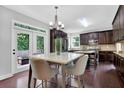 A modern kitchen area features a marble top table with seating and stainless steel appliances at 48 Scenic Ovlk, Acworth, GA 30101