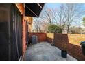 Enclosed outdoor patio area, perfect for relaxing and entertaining with brick privacy wall at 906 Little Bear Cove Ne, Conyers, GA 30012