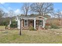 Stone-clad cottage with a quaint pathway and landscaped front yard at 1164 Sandtown Sw Rd, Marietta, GA 30008