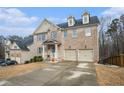 Attractive two-story home boasts a two-car garage and neutral brick exterior with well-maintained landscaping at 5288 Clingman Ct, Douglasville, GA 30135