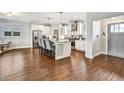 Bright kitchen featuring stainless appliances, white cabinets, and a kitchen island with stool seating at 5293 Hearthstone St, Stone Mountain, GA 30083