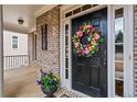 Charming front door with a decorative floral wreath and brick facade at 1903 Brackendale Nw Rd, Kennesaw, GA 30152