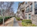 Attractive townhome exteriors showcasing brick facade, balconies, and well-maintained grounds at 1012 E Paces Chase Ne, Atlanta, GA 30326