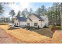 The rear exterior view shows the home's well-maintained backyard and a partial view of the home's structure at 1312 Mcgarity Rd, Temple, GA 30179
