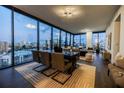 Spacious dining room with a large table, seating for six, and expansive windows overlooking the city at 788 W Marietta Nw St # 1302, Atlanta, GA 30318