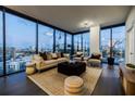 Bright living room features large windows with views of the cityscape at 788 W Marietta Nw St # 1302, Atlanta, GA 30318