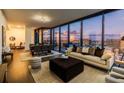 Open-concept living and dining area with floor-to-ceiling windows offering panoramic city views and modern decor at 788 W Marietta Nw St # 1302, Atlanta, GA 30318