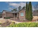 Attractive brick home with a two-car garage and lush landscaping, offering great curb appeal at 104 Big Meadows Dr, Canton, GA 30114