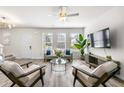 Bright living room with stylish furniture, large windows, and an open layout, perfect for relaxing at 1947 Thomasville Estate Dr, Atlanta, GA 30315