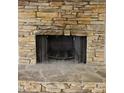 Close-up of the beautiful stone fireplace at 1345 Smoke Hill Dr, Hoschton, GA 30548