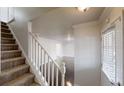 Inviting entryway showcases staircase, and window for ample natural light at 2134 Elinwood Dr, Atlanta, GA 30344