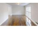 Open living room with hardwood floors and large windows for natural light and ventilation at 2134 Elinwood Dr, Atlanta, GA 30344