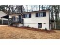 Exterior of a two-story home with a covered parking and a cozy front porch at 2232 Addison Nw Pl, Atlanta, GA 30318