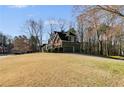 Traditional two-story home with side-entry garage on a well-manicured lawn at 5712 Overlook Cir, Powder Springs, GA 30127