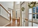 Bright foyer with hardwood floors and staircase, offering a grand entrance at 5712 Overlook Cir, Powder Springs, GA 30127