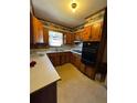 Classic kitchen featuring wood cabinets and vintage appliances at 614 Hunnicutt Se Rd, Mableton, GA 30126