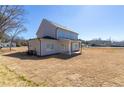 Spacious backyard with a covered patio, perfect for outdoor entertaining and relaxation at 7477 Caribou Trl, Riverdale, GA 30296