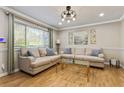 Inviting living room featuring hardwood floors, light-colored sofas, and a view of the window at 1600 Briarcliff Ne Rd # 5, Atlanta, GA 30306