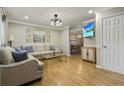 Bright living room with hardwood floors, neutral decor, modern lighting, and comfortable seating at 1600 Briarcliff Ne Rd # 5, Atlanta, GA 30306