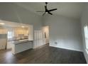 Open-concept living space with vaulted ceilings, a ceiling fan and hardwood floors throughout at 937 Camilla Sw St, Atlanta, GA 30314
