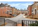 Beautiful view of townhome community with lush landscaping and inviting street appeal at 1583 Mosaic Way, Smyrna, GA 30080