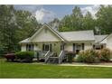 Charming single-story home featuring well-maintained lawn and a welcoming front porch at 281 Laney Dr, Locust Grove, GA 30248