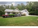 Charming single-story home featuring well-maintained lawn and a welcoming front porch at 281 Laney Dr, Locust Grove, GA 30248