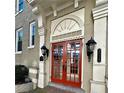 Elegant entrance with red double doors, flanked by vintage-style lanterns at 1116 Piedmont Ne Ave # 12, Atlanta, GA 30309