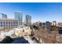 Stunning city views from the property's window, showcasing the surrounding architecture and urban landscape at 300 W Peachtree St # 8C, Atlanta, GA 30308