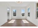 Bright, light filled bedroom with hardwood floors and two large windows at 1857 Defoor Ave, Atlanta, GA 30318