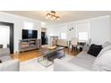 Inviting living room with hardwood floors, comfortable sofas, and a modern entertainment center at 300 W Peachtree St # 10D, Atlanta, GA 30308