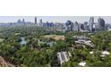 Stunning aerial view of a city skyline with a lush green park in the foreground at 581 Sherwood Ne Rd, Atlanta, GA 30324