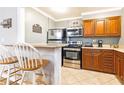 Kitchen boasts stainless appliances, granite countertops and wood cabinets at 300 W Peachtree St # 4A, Atlanta, GA 30308