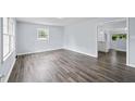 Spacious living room filled with natural light and modern hardwood flooring at 463 Flint Trl, Jonesboro, GA 30236