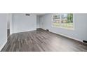 Bright living room with large windows and stylish hardwood flooring at 463 Flint Trl, Jonesboro, GA 30236