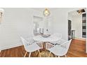 Bright dining room with a marble table, stylish chairs, and hardwood floors at 1600 Temple Ave, Atlanta, GA 30337