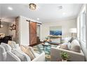 Comfortable living room with hardwood floors, lots of natural light, and modern furnishings at 253 Mcintosh Avenue Ne, Marietta, GA 30060