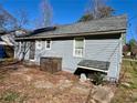 View of the home's exterior showcasing access to the backyard at 1703 Stanton Sw Rd, Atlanta, GA 30311