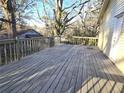 Spacious wood deck perfect for outdoor entertaining with wooden railing and tree view at 3254 Howell Cir, Duluth, GA 30096