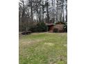 Charming single-story home with well-maintained lawn and mature trees at 2765 Rollingwood Se Ln, Atlanta, GA 30316