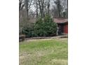 Charming one-story brick home with a landscaped front yard and mature plantings at 2765 Rollingwood Se Ln, Atlanta, GA 30316