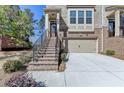 Beautiful brick townhome with a garage and manicured landscaping at 376 Provenance Dr, Atlanta, GA 30328